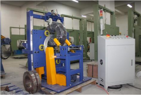 Pipe and hose coil stretch wrapping machines