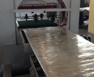 Orbital wrapping machine packing wooden doors, windows, moulding, profiles and posts